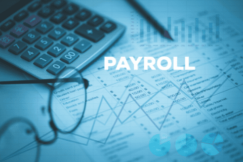 A calculator, eyeglasses, and a payroll document with graphs and charts, illustrating financial and payroll calculations.